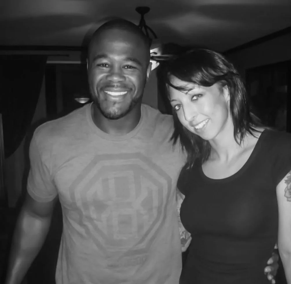 Brittney Noelle alongside a fighter in a candid black-and-white photo — connection to the combat-sports community