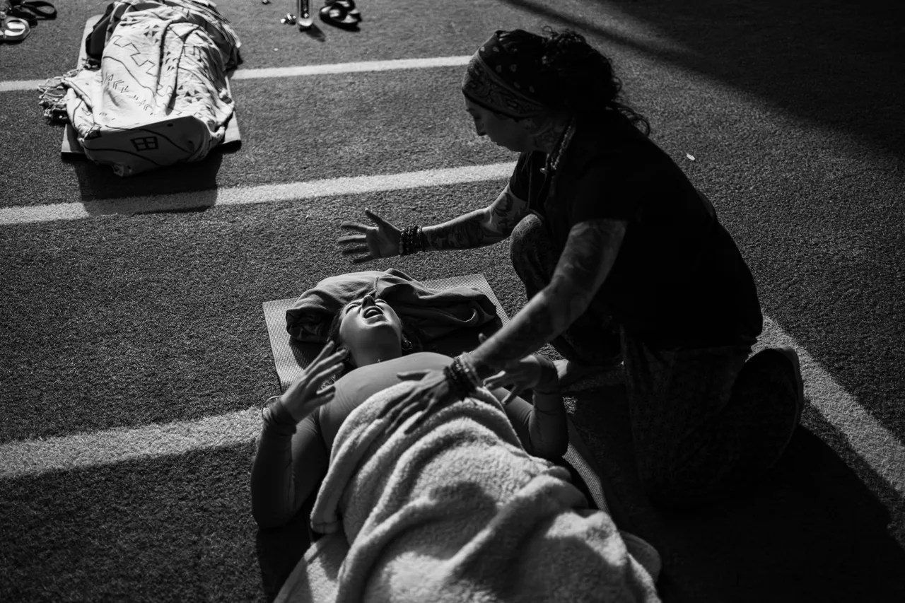Brittney Noelle performing bodywork on an athlete on a training turf — Damage Control Method